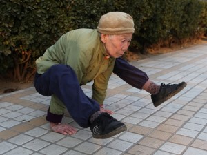 Image: 0088130649, License: Rights managed, (101205) -- BEIJING, Dec. 5, 2010 (Xinhua) -- Eighty-two-year-old Zhao Yufang exercises in the residential compound she lives in Beijing, capital of China, Dec. 4, 2010. Zhao created herself a unique body exercise combining Yoga, Wushu or martial arts, and Qigong or breathing exercise in her sixties, and three hours of daily practice over years has granted her with good fitness. (Xinhua/Liu Yu) (cxy), Place: ,, Model Release: No or not aplicable, Credit line: ., Eyevine